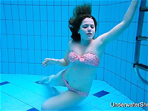 marvelous nymph demonstrates splendid figure underwater